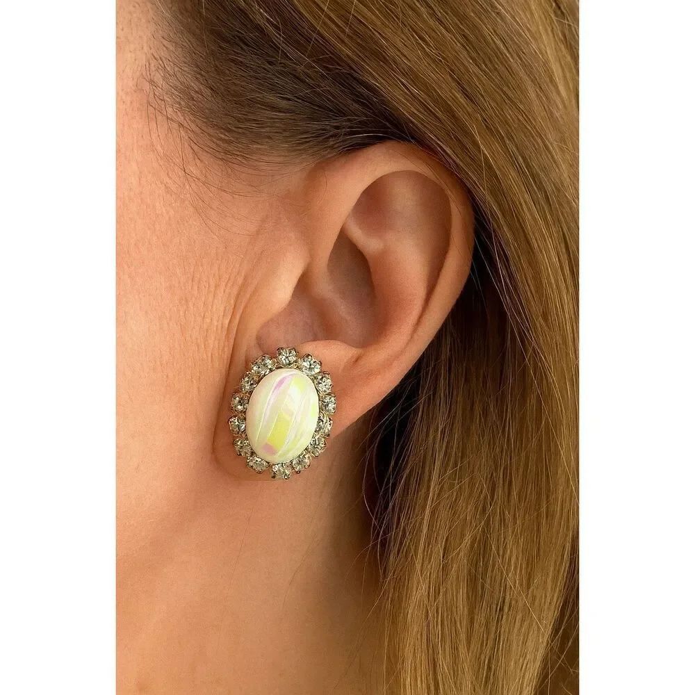 Vintage clip style rhinestone framed AB white glass earrings.